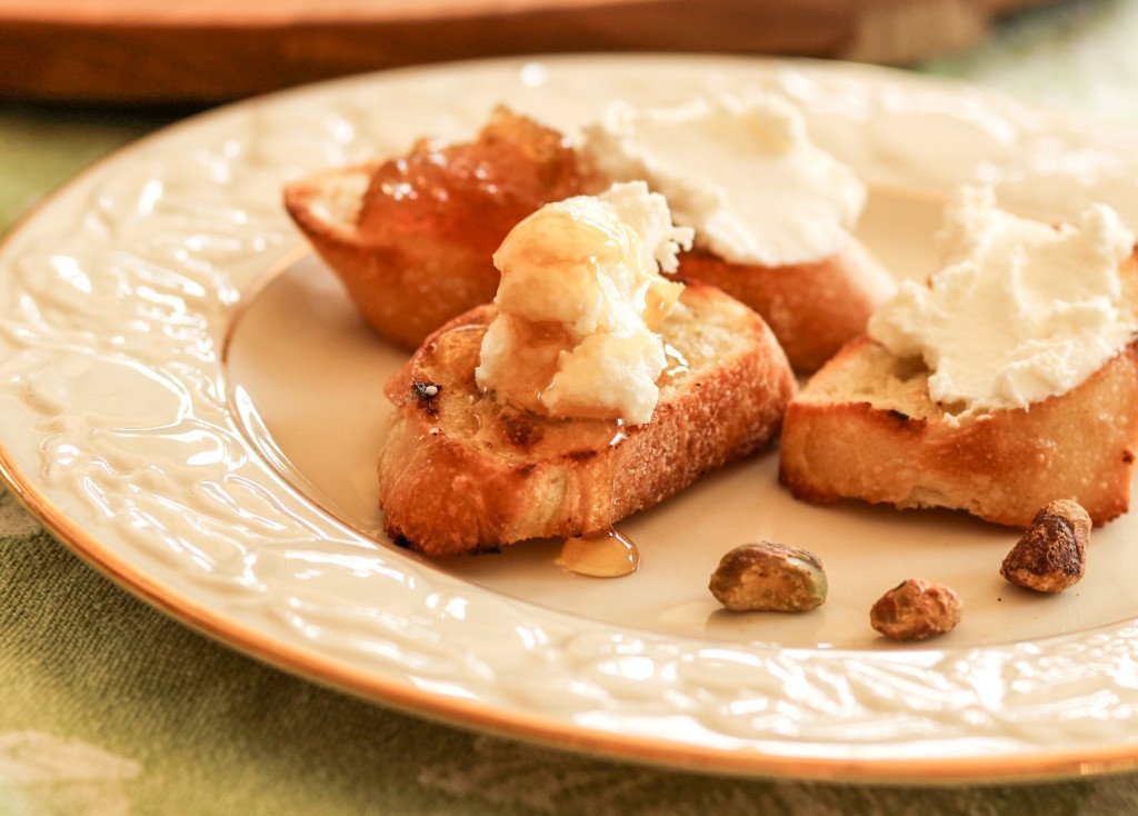 pantry essentials honey on ricotta cheese crostini