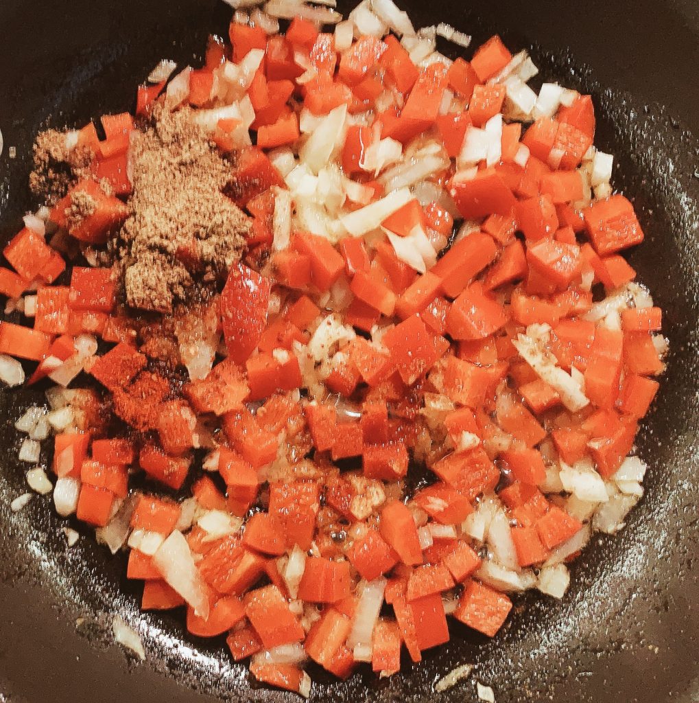 Sauteing Onions and Peppers for Shakshouka Spices Added