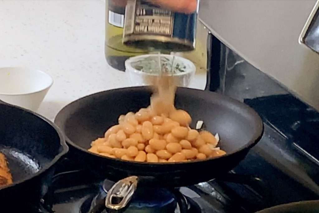 White beans with garlic and herbs is one of the easiest and most versatile side dishes -- Four ingredients that adapt to fit your needs