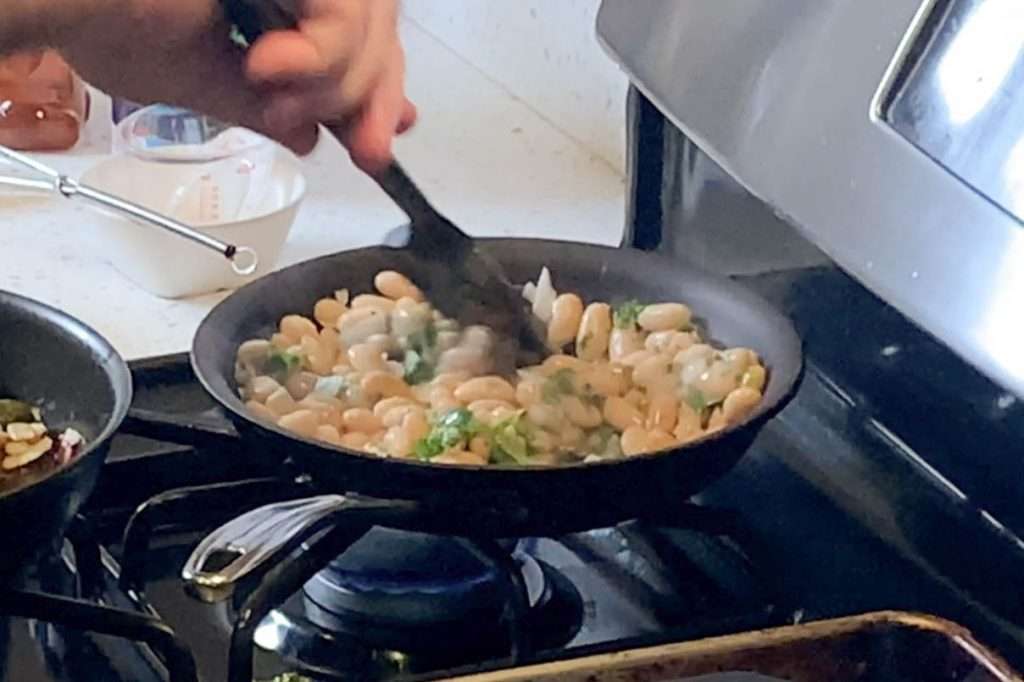 White beans with garlic and herbs is one of the easiest and most versatile side dishes -- Four ingredients that adapt to fit your needs