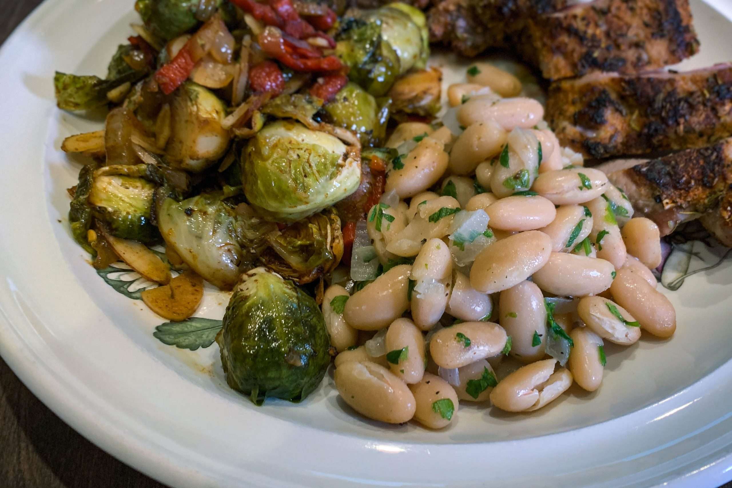 White beans with garlic and herbs is one of the easiest and most versatile side dishes -- Four ingredients that adapt to fit your needs